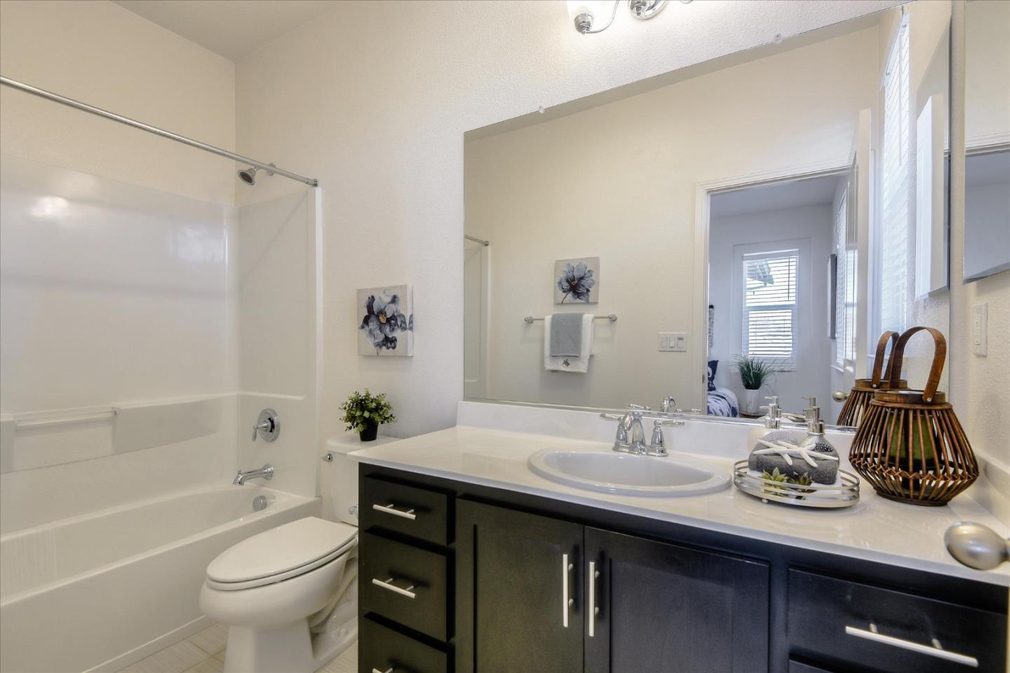1915 McCandless Drive Milpitas, CA 95035 - Photo 13 of 28 a bathroom with a granite countertop sink a toilet and shower