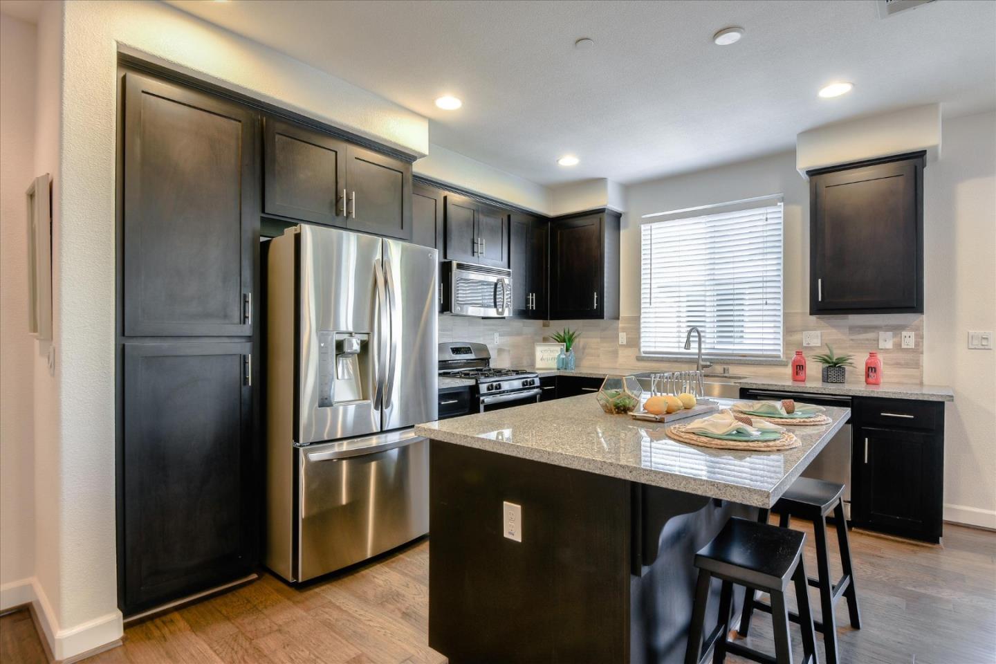 1915 McCandless Drive Milpitas, CA 95035 - Photo 19 of 28 a kitchen with a refrigerator and a sink