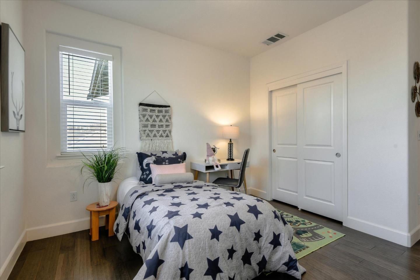 1915 McCandless Drive Milpitas, CA 95035 - Photo 22 of 28 a bedroom with a bed and wooden floor