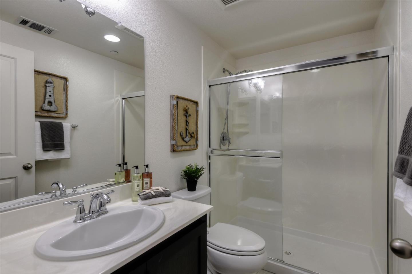 1915 McCandless Drive Milpitas, CA 95035 - Photo 24 of 28 a bathroom with a sink toilet and shower