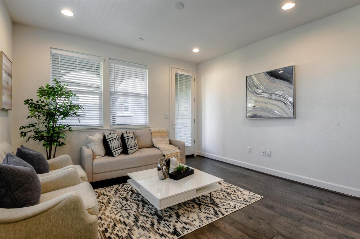 1915 McCandless Drive Milpitas, CA 95035 - Photo 5 of 28 a living room with furniture and a potted plant