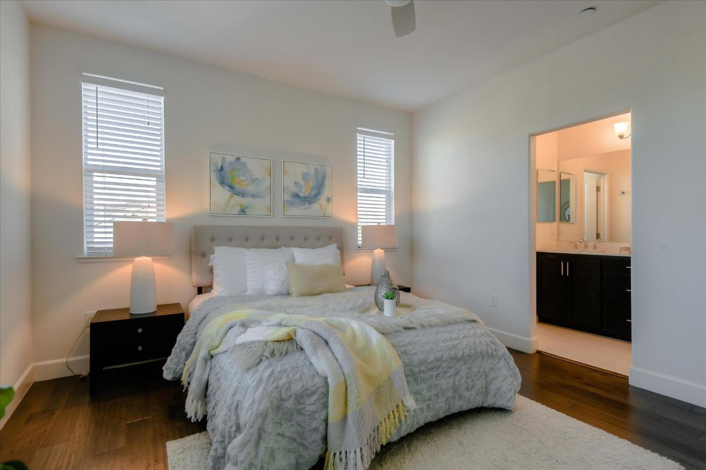 1915 McCandless Drive Milpitas, CA 95035 - Photo 7 of 28 a bedroom with a bed and wooden floor