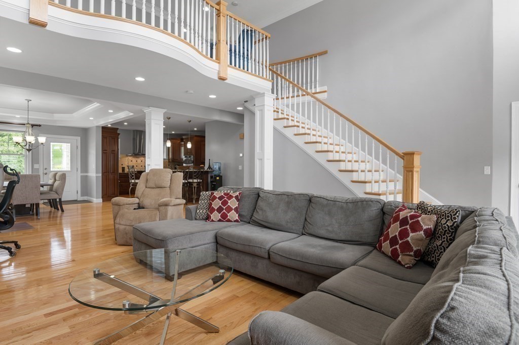 6 St James Drive Andover, MA 01810 - Photo 1 of 1 a living room with furniture or kitchen and a wooden floor