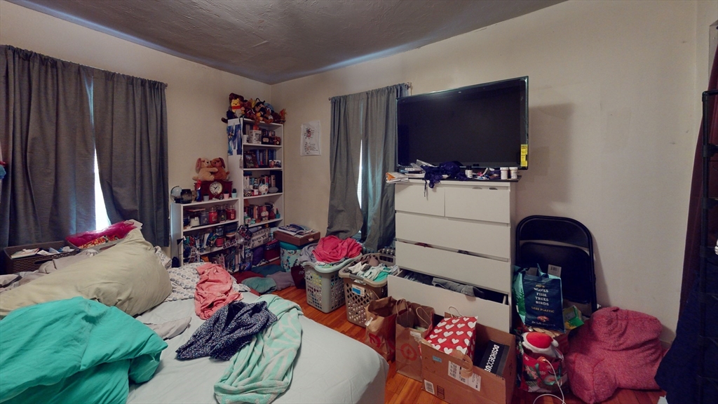 9 R Winship Street, Unit A Boston, MA 02135 - Photo 5 of 10 a room with furniture toys and a flat screen tv