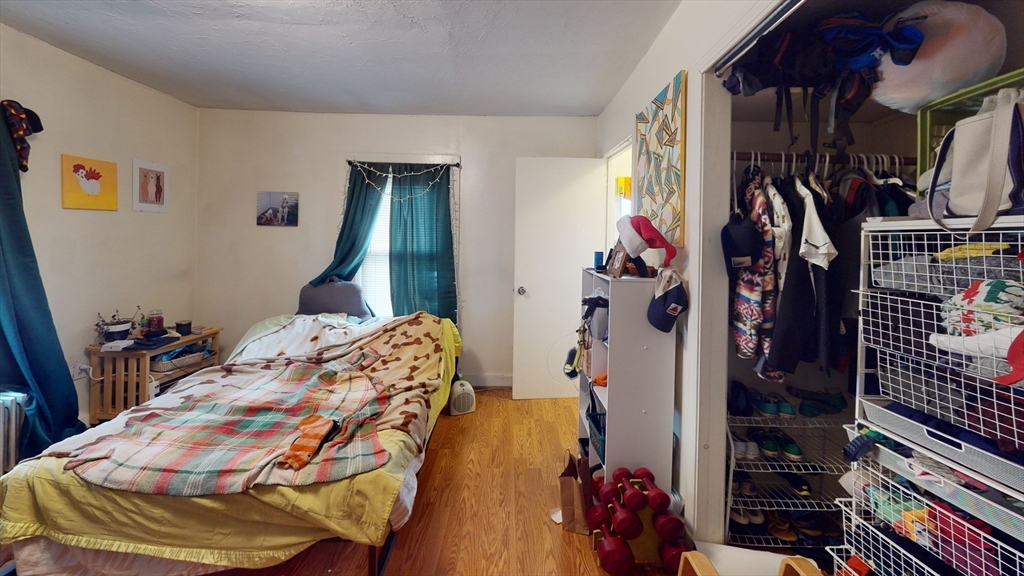 9 R Winship Street, Unit A Boston, MA 02135 - Photo 6 of 10 a bedroom with a bed and a closet