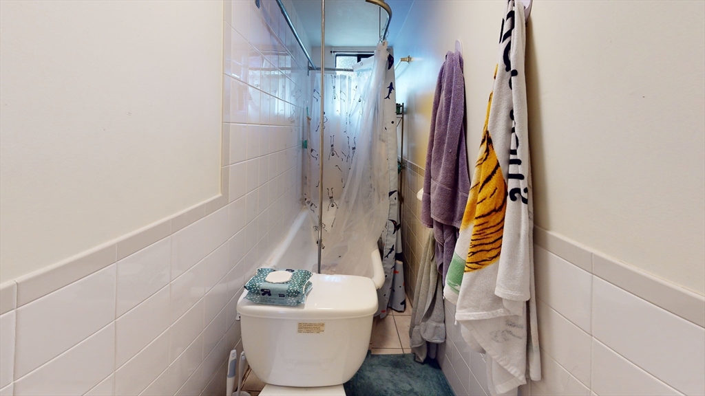 9 R Winship Street, Unit A Boston, MA 02135 - Photo 8 of 10 a bathroom with a sink and mirror