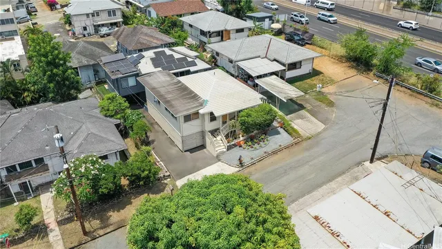 an aerial view of residential houses with outdoor space