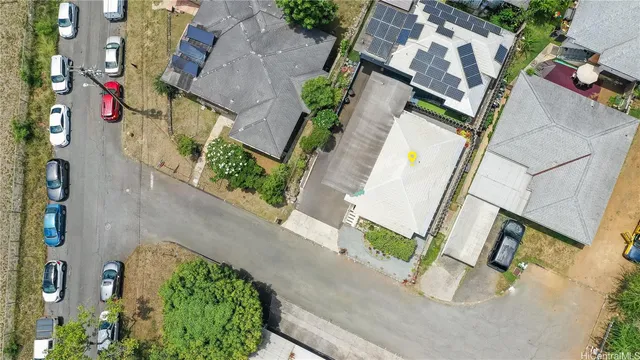 an aerial view of a house with a garden and plants