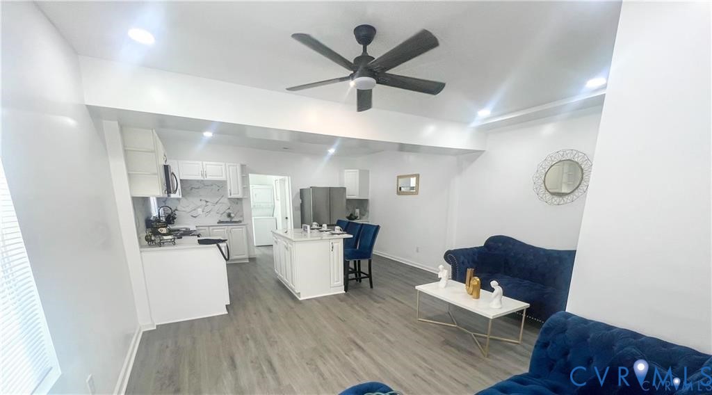 1340 Rome Street Petersburg, VA 23803 - Photo 13 of 35 a living room with furniture and a wooden floor