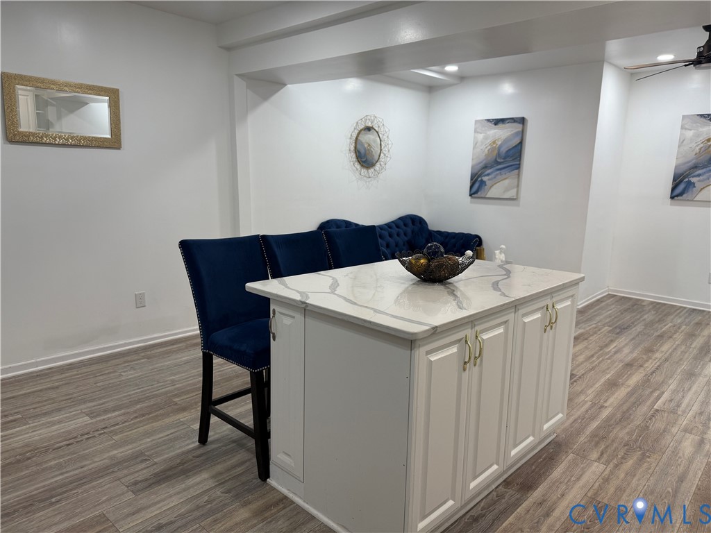 1340 Rome Street Petersburg, VA 23803 - Photo 16 of 35 a kitchen with a table chairs and wooden floor