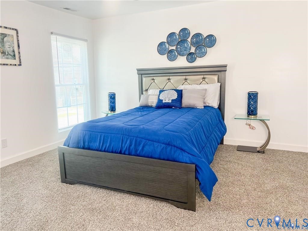 1340 Rome Street Petersburg, VA 23803 - Photo 28 of 35 a bedroom with a bed dresser and window