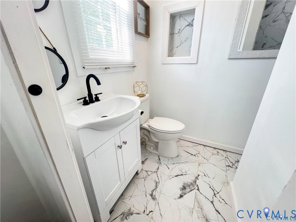 1340 Rome Street Petersburg, VA 23803 - Photo 31 of 35 a bathroom with a sink toilet and shower