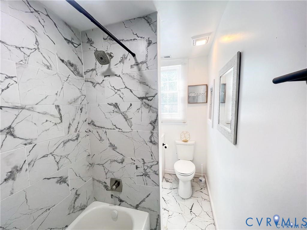 1340 Rome Street Petersburg, VA 23803 - Photo 32 of 35 a bathroom with a toilet and a shower curtain