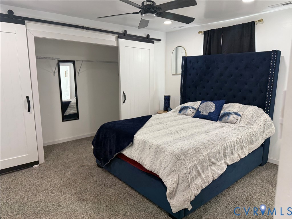 1340 Rome Street Petersburg, VA 23803 - Photo 33 of 35 a bedroom with a bed and dresser