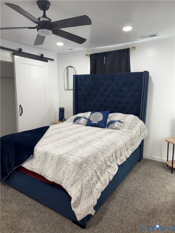 1340 Rome Street Petersburg, VA 23803 - Photo 34 of 35 a large bed sitting in a room next to a lamp with kitchen view