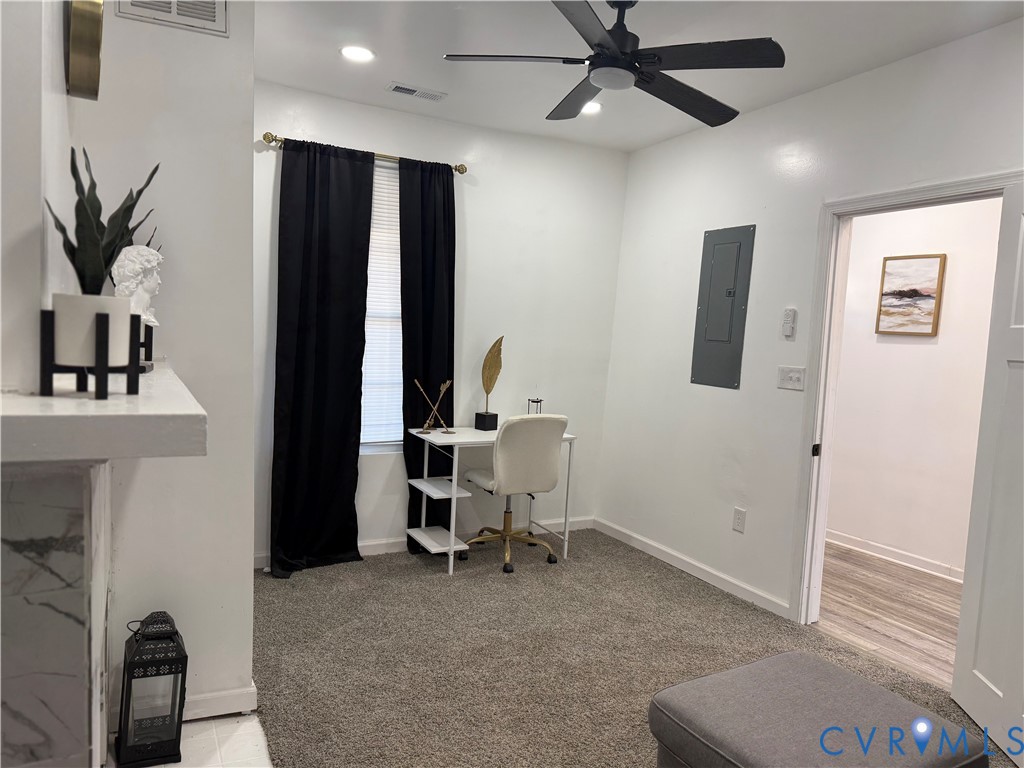 1340 Rome Street Petersburg, VA 23803 - Photo 4 of 35 a view of a workspace with furniture and a window