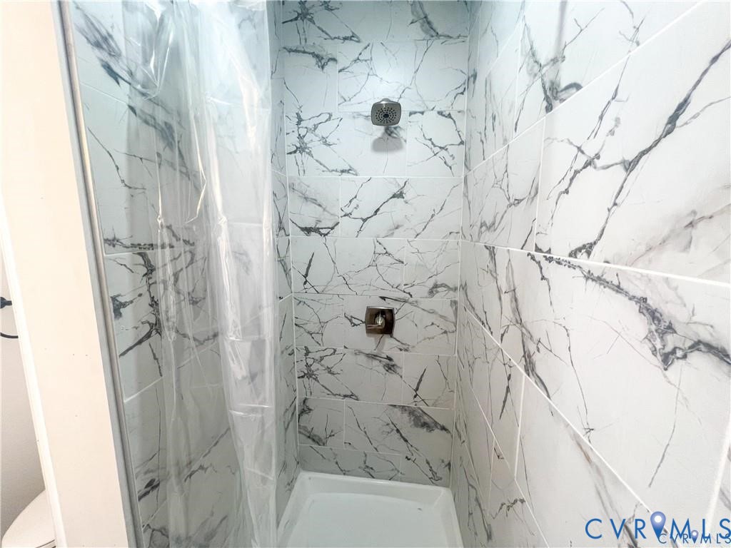 1340 Rome Street Petersburg, VA 23803 - Photo 8 of 35 a bathroom with a shower curtain