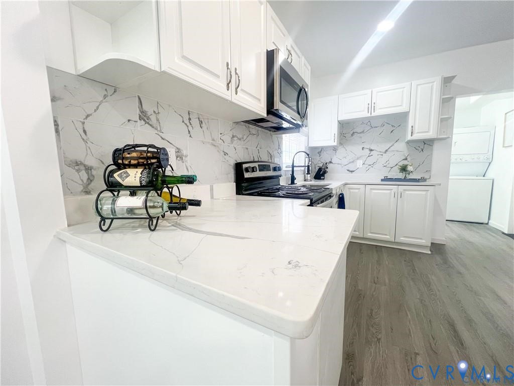 1340 Rome Street Petersburg, VA 23803 - Photo 10 of 35 a kitchen with stainless steel appliances granite countertop a sink a stove a refrigerator cabinets a dining table and chairs