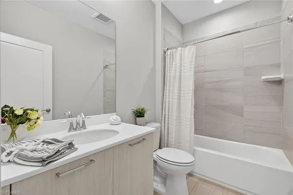 a bathroom with a sink a toilet and a bathtub