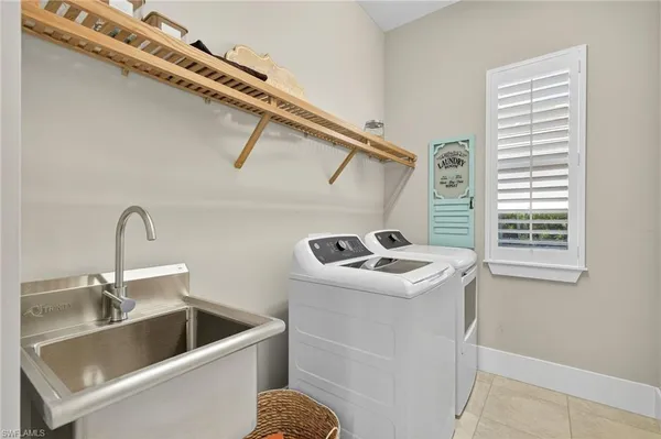 a kitchen with a sink and a stove top oven
