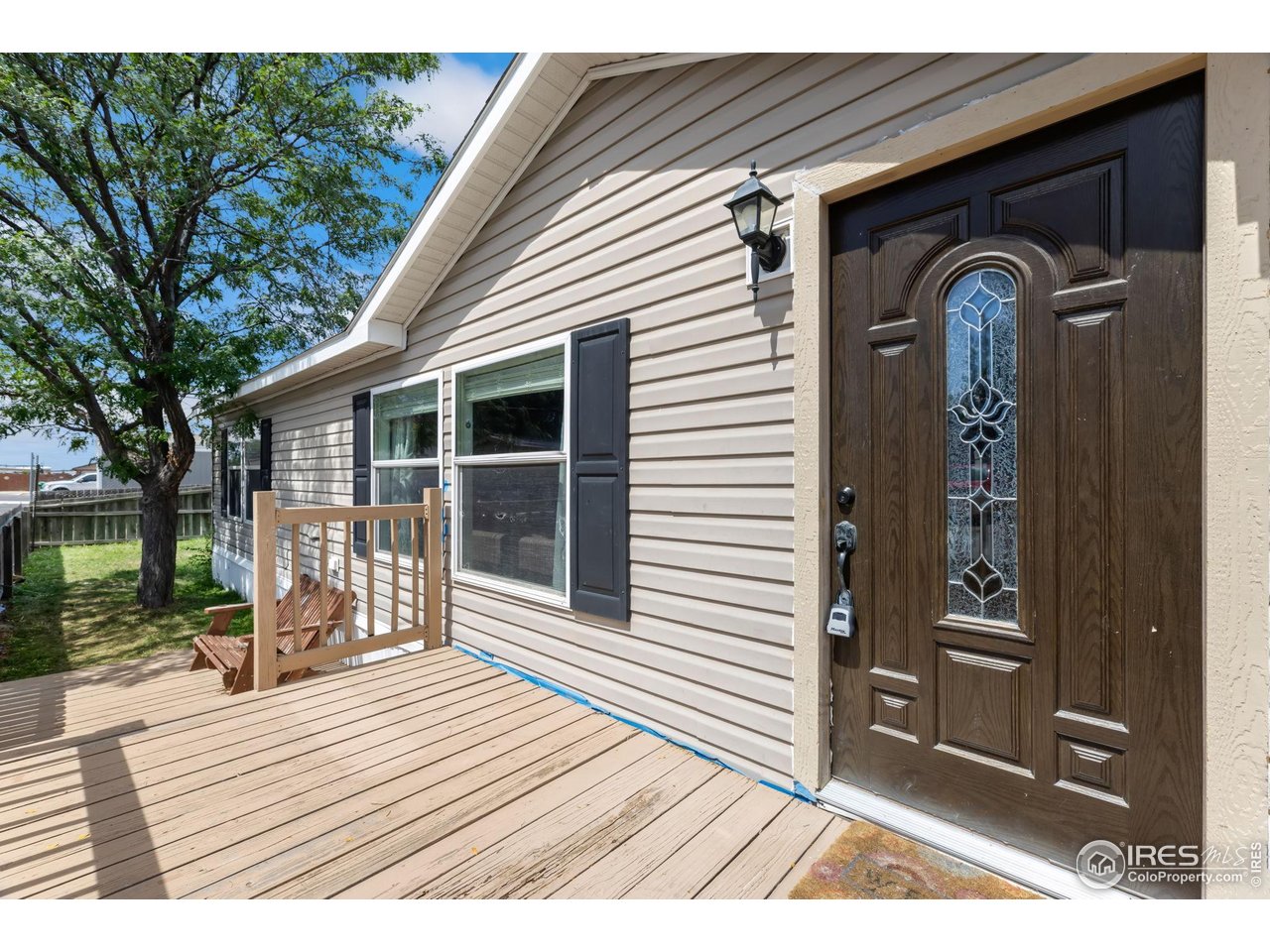 218 Grape Street, Unit 29 Hudson, CO 80642 - Photo 6 of 26 a front view of a house with a porch