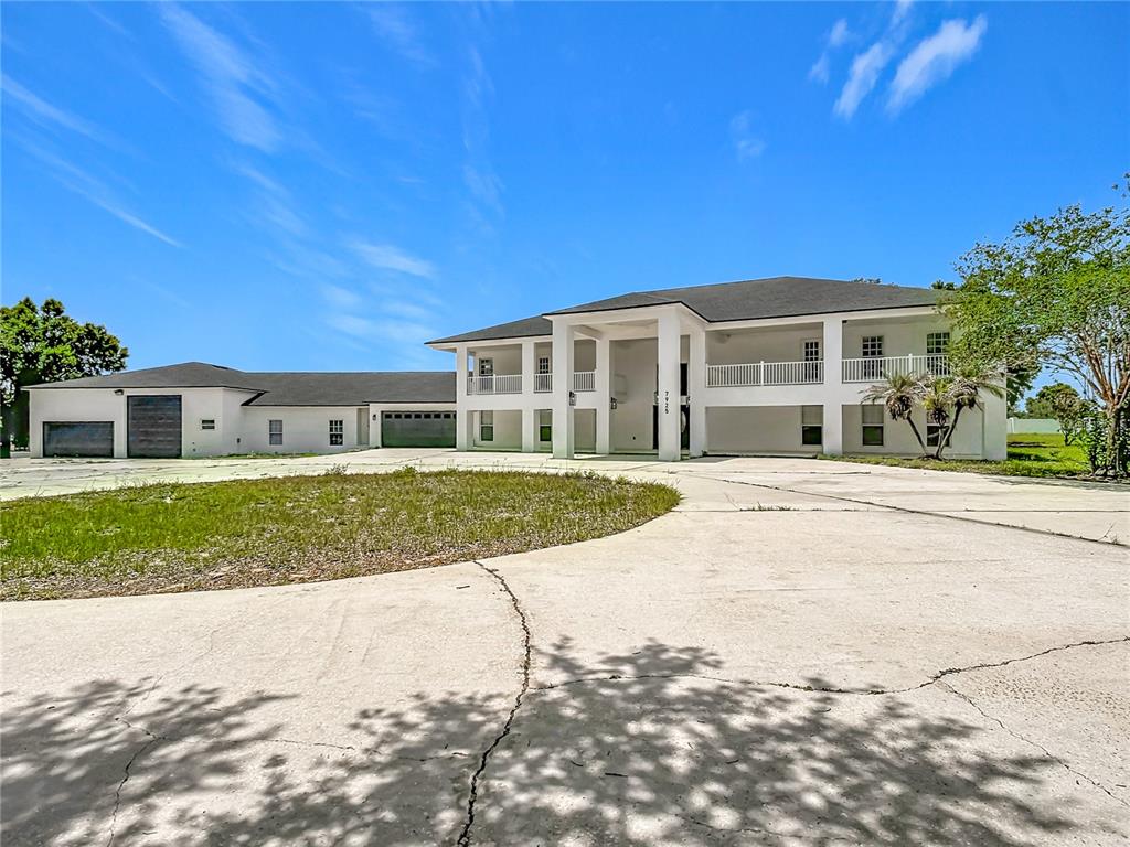 7925 Lake Mabel Loop Road Lake Wales, FL 33898 - Photo 11 of 97 a front view of house with yard and green space