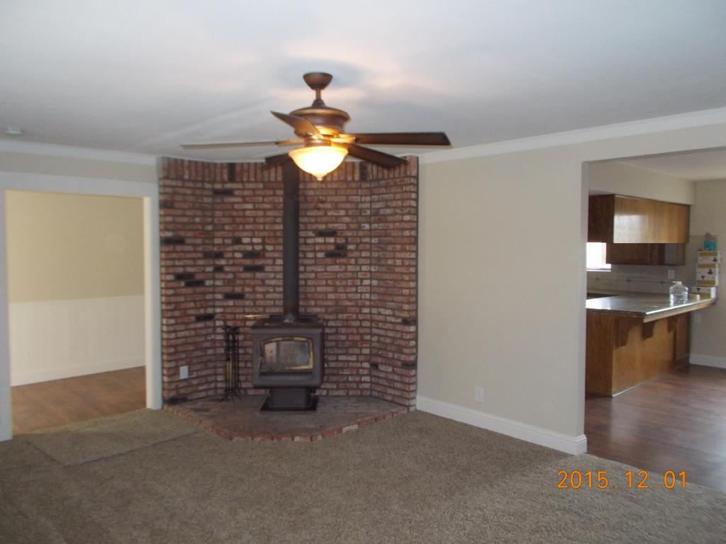 29581 Butterfield Way Tehachapi, CA 93561 - Photo 3 of 5 a view of an empty room and fire place