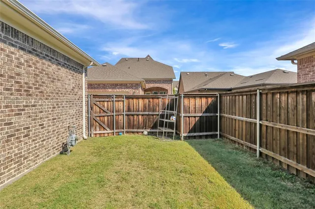 a view of a backyard with a small cabin