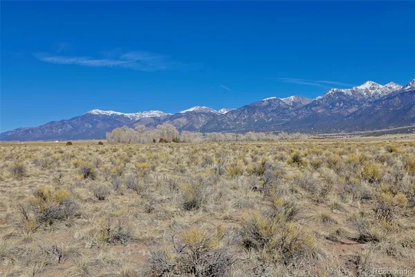 a view of a mountain with a mountain in the background