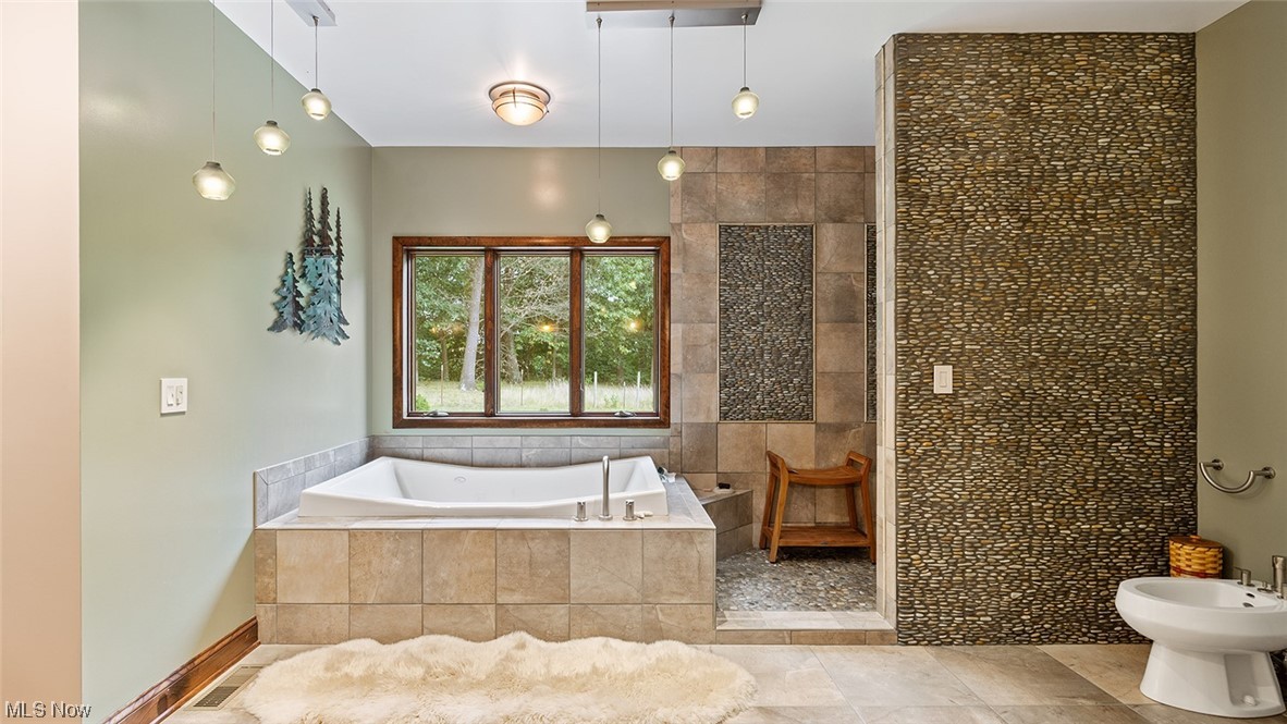 57430 Ohio Riverview Road Shadyside, OH 43947 - Photo 20 of 35 Master bathroom featuring light tile flooring and independent shower and bath