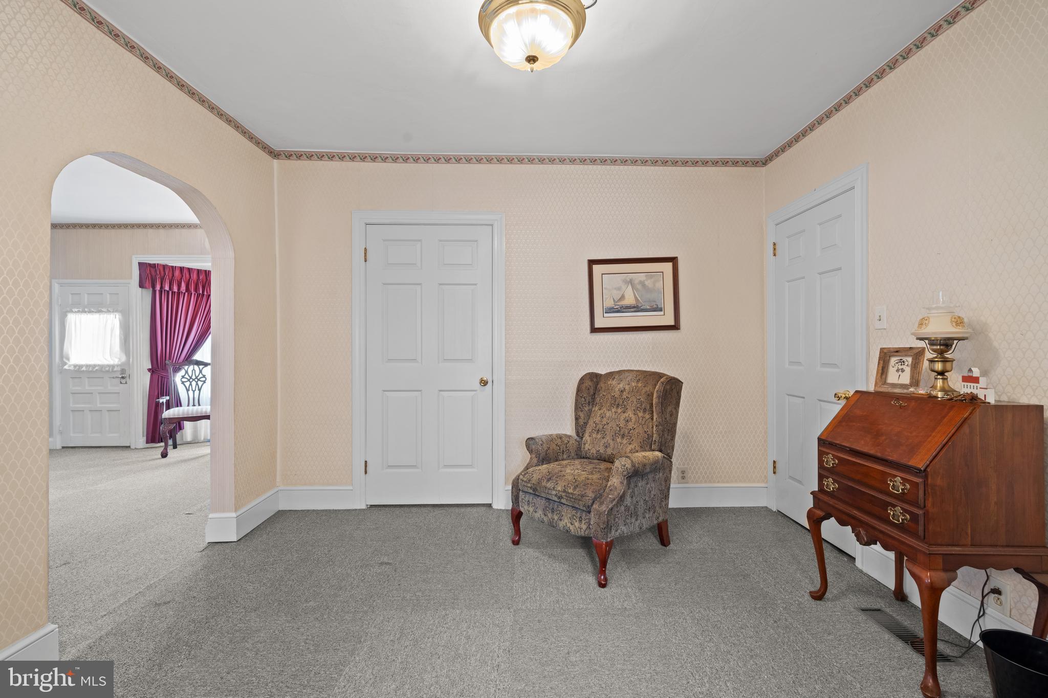 643 Main Street Leesburg, NJ 08327 - Photo 16 of 30 a living room with furniture and a chair
