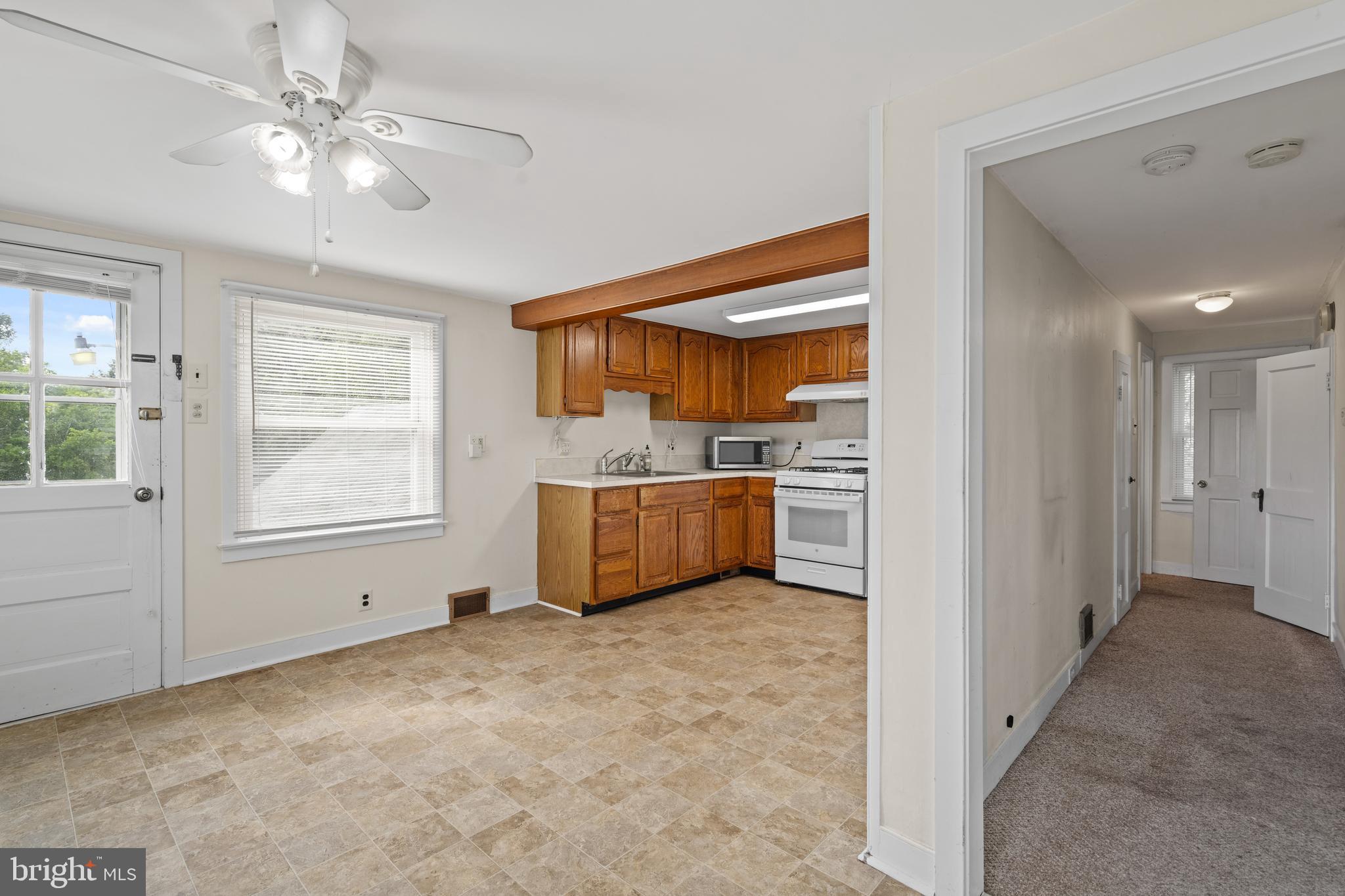 643 Main Street Leesburg, NJ 08327 - Photo 23 of 30 a view of a kitchen with a sink and a window
