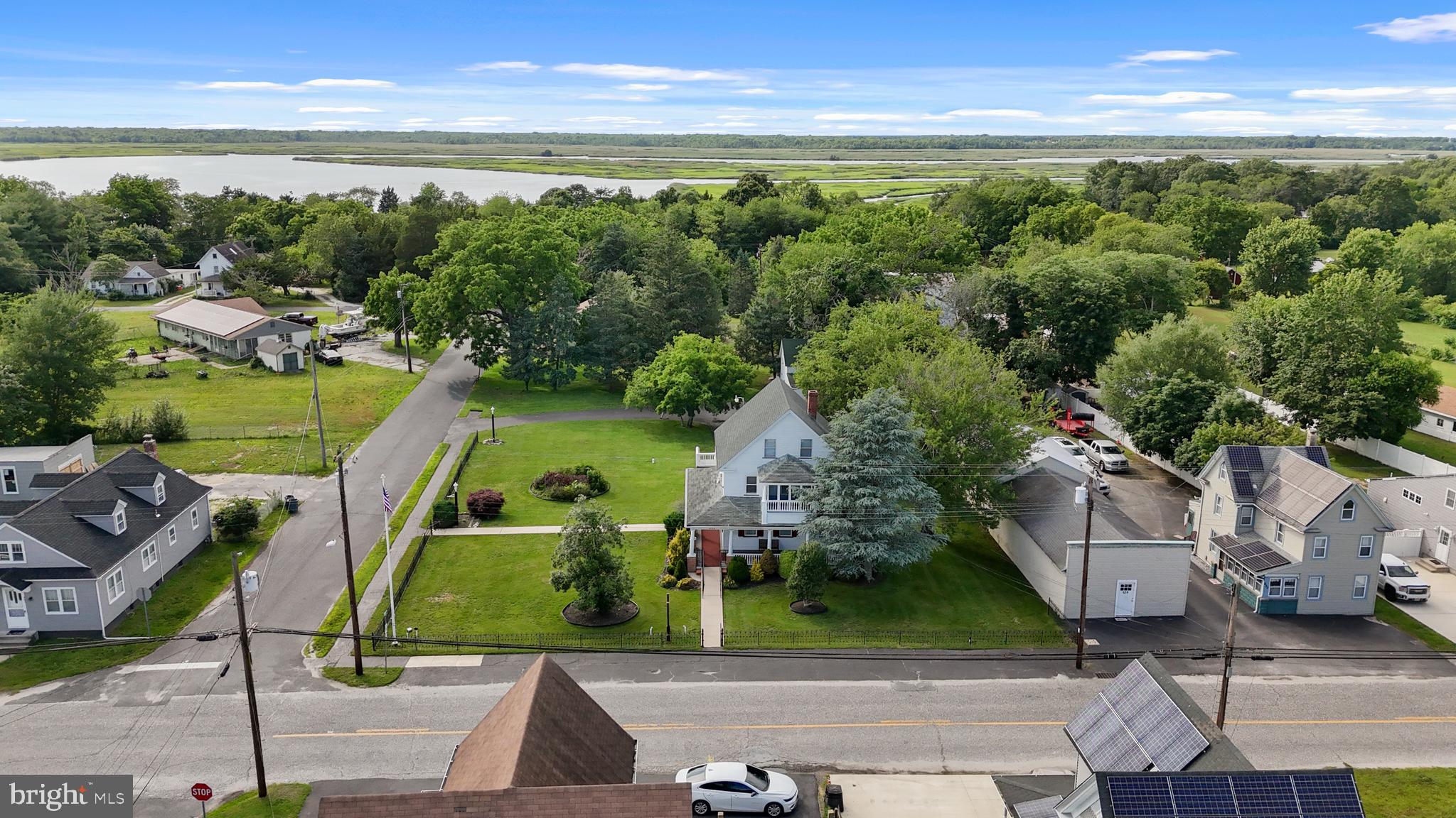 643 Main Street Leesburg, NJ 08327 - Photo 3 of 30 an aerial view of a house with a garden and lake view