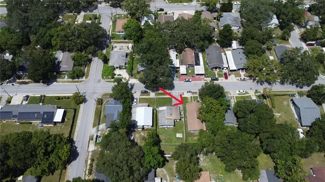 an aerial view of multiple houses with yard