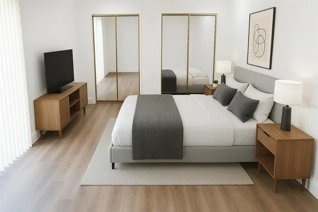 a bedroom with a bed and a couch
