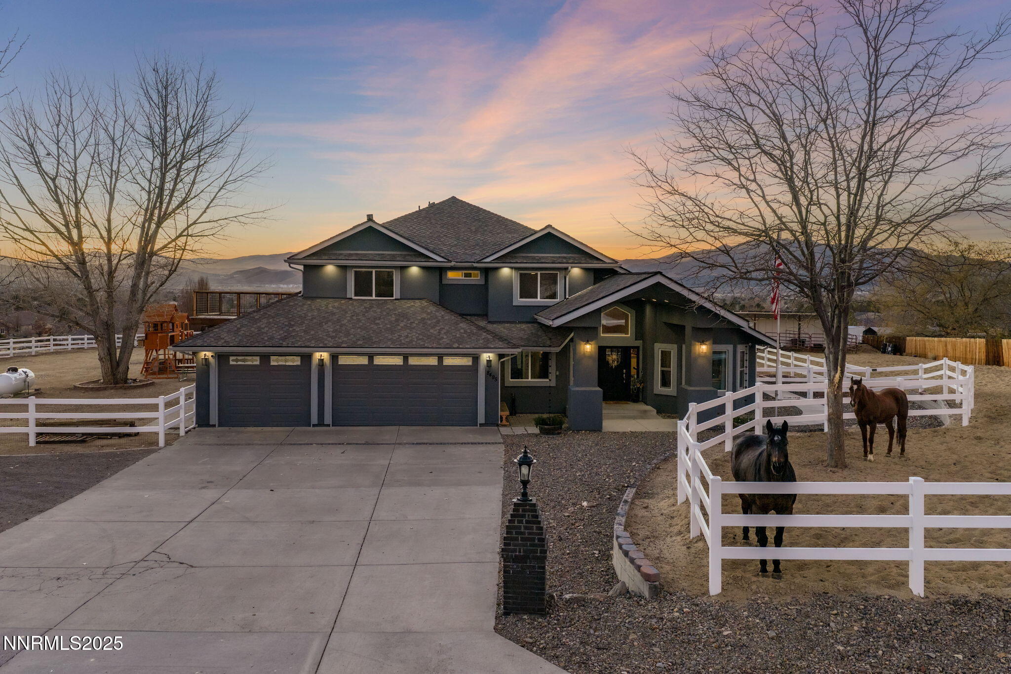 a view of a house with a wooden fence