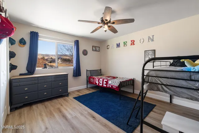 a bedroom with a bed and a dresser in it