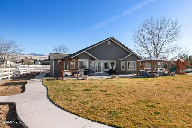 a front view of a house with yard patio and livingroom view
