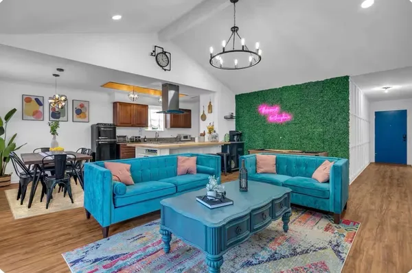 a living room with fireplace furniture and a flat screen tv