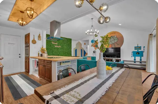 a living room with fireplace furniture and a flat screen tv