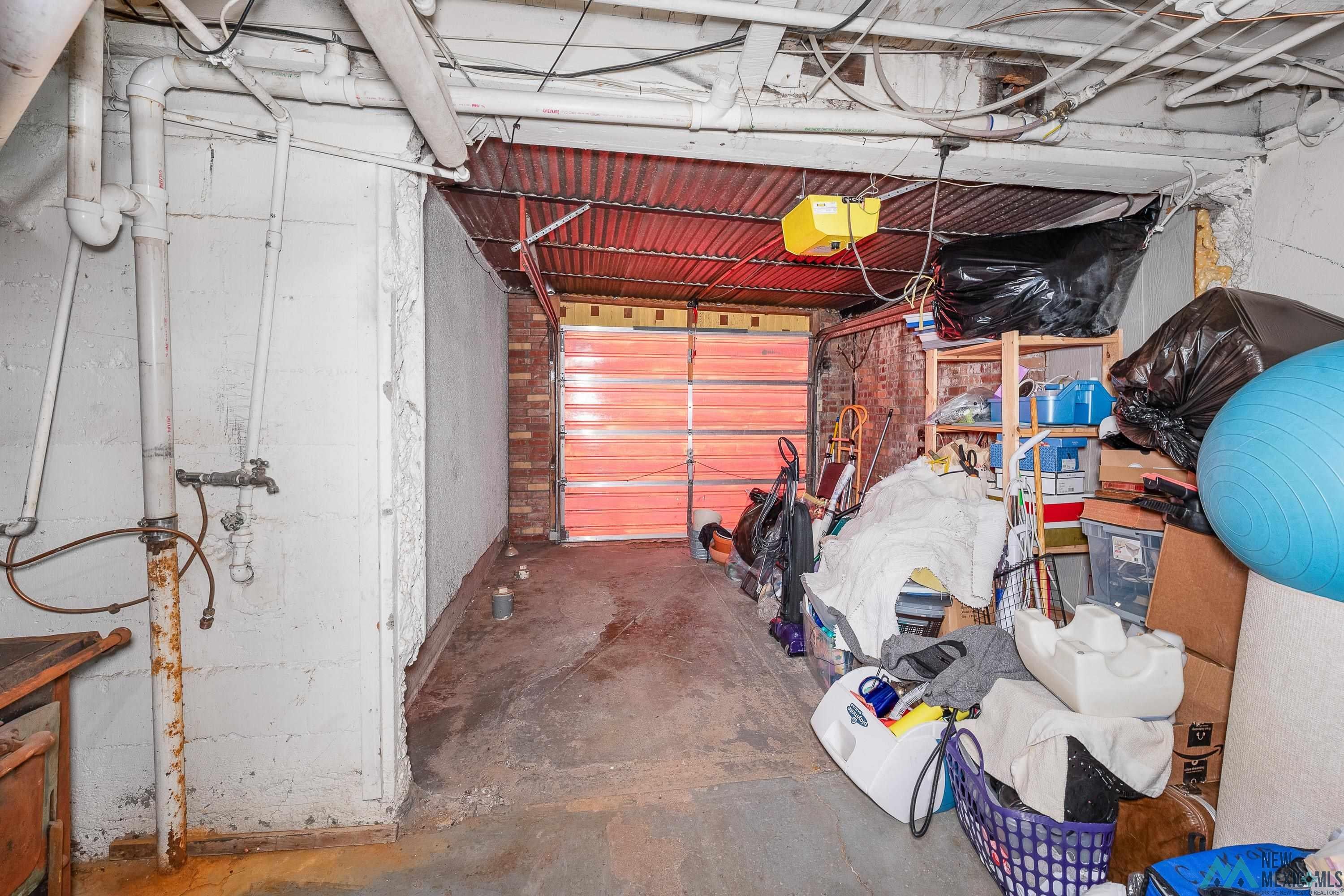 727 South 6th Street Raton, NM 87740 - Photo 30 of 47 Garage featuring a garage door opener