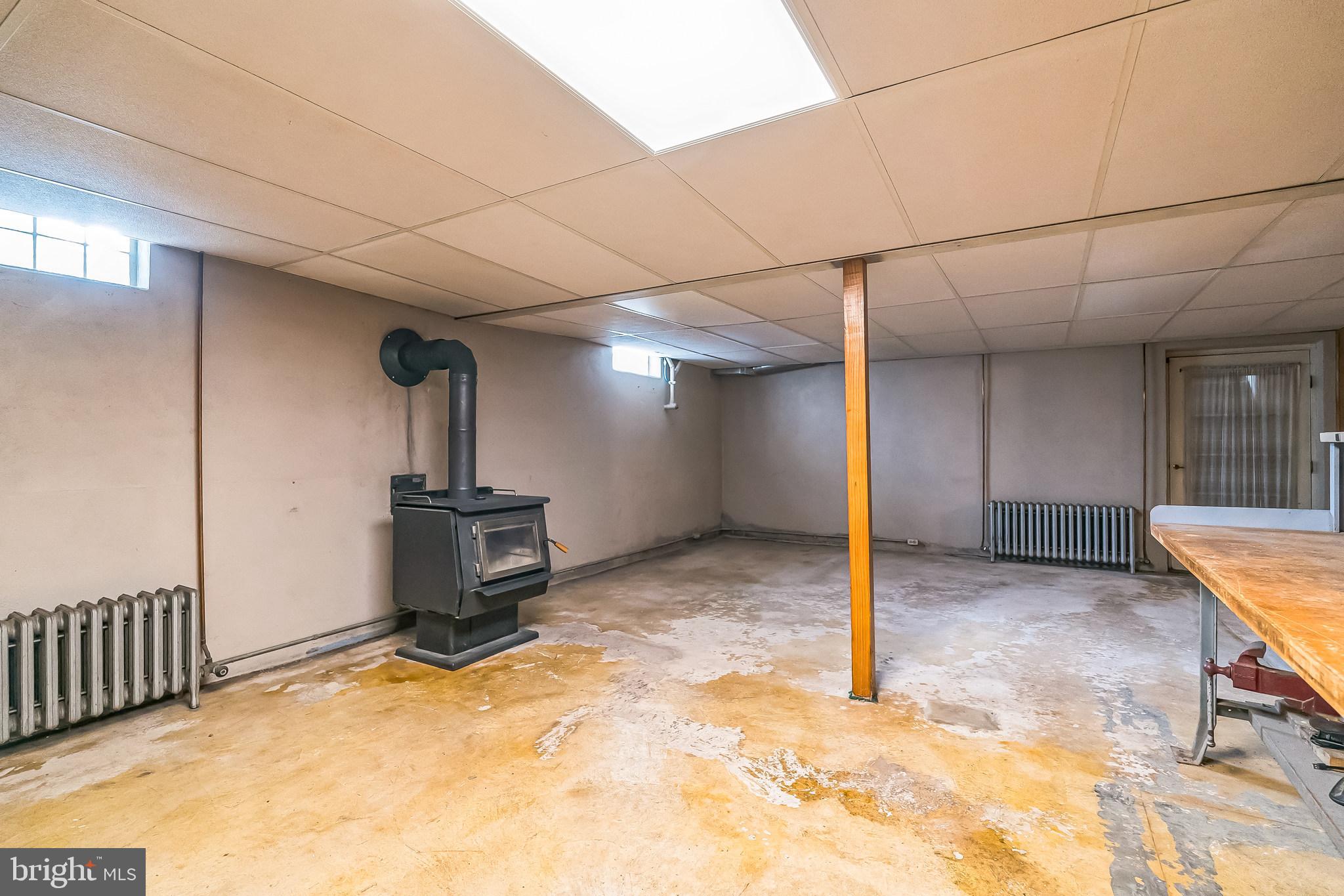 2287 East Buck Road Pennsburg, PA 18073 - Photo 26 of 32 Basement w Wood Burning Stove