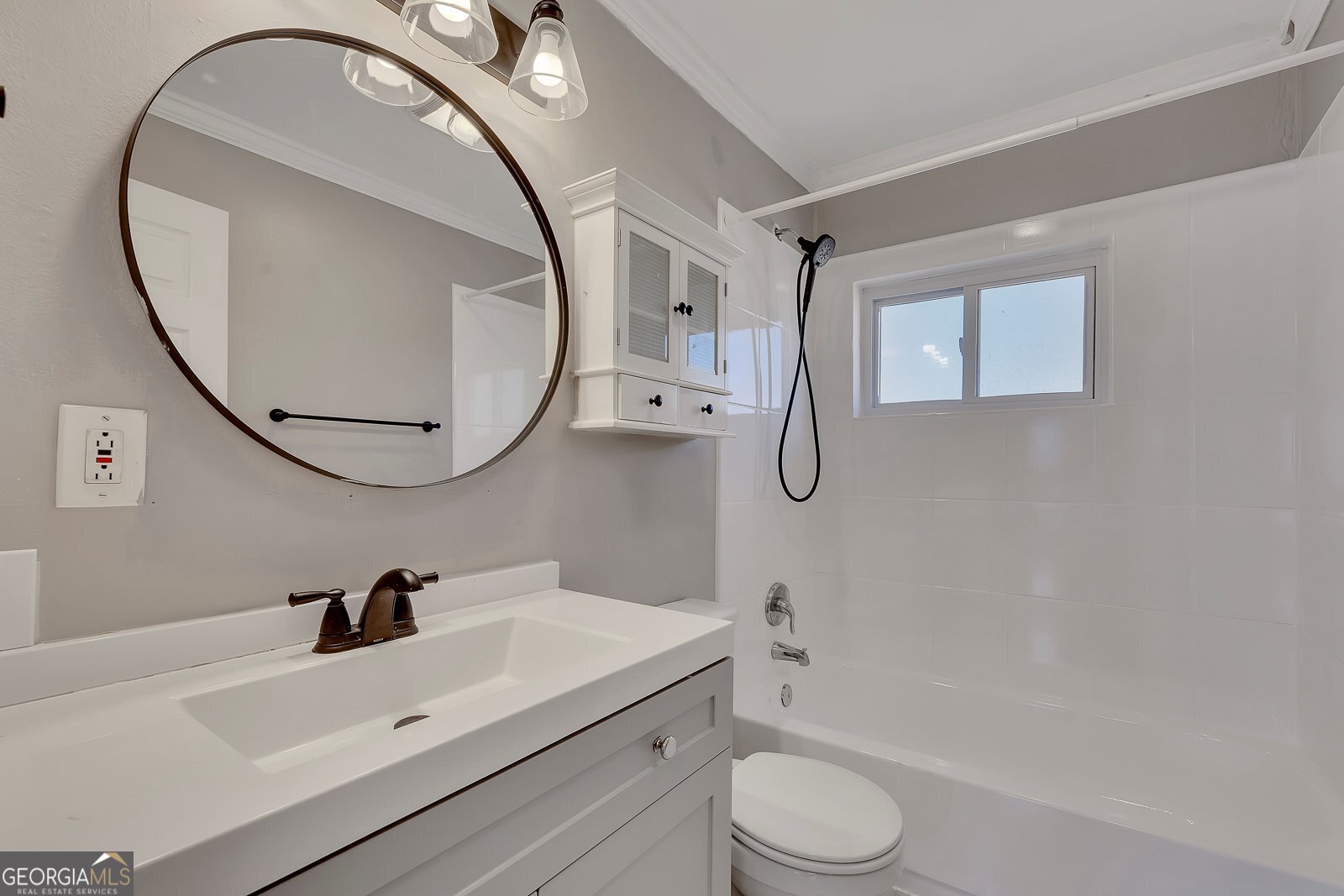 1040 Herndon Street Northwest, Unit A Atlanta, GA 30318 - Photo 11 of 28 a bathroom with a sink a toilet and a mirror