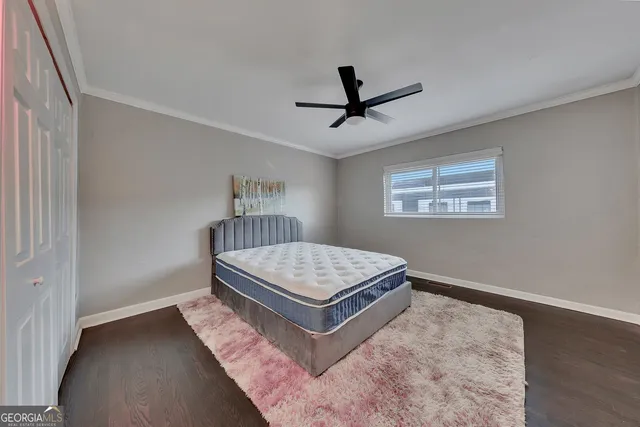 a living room with a bed furniture and a window