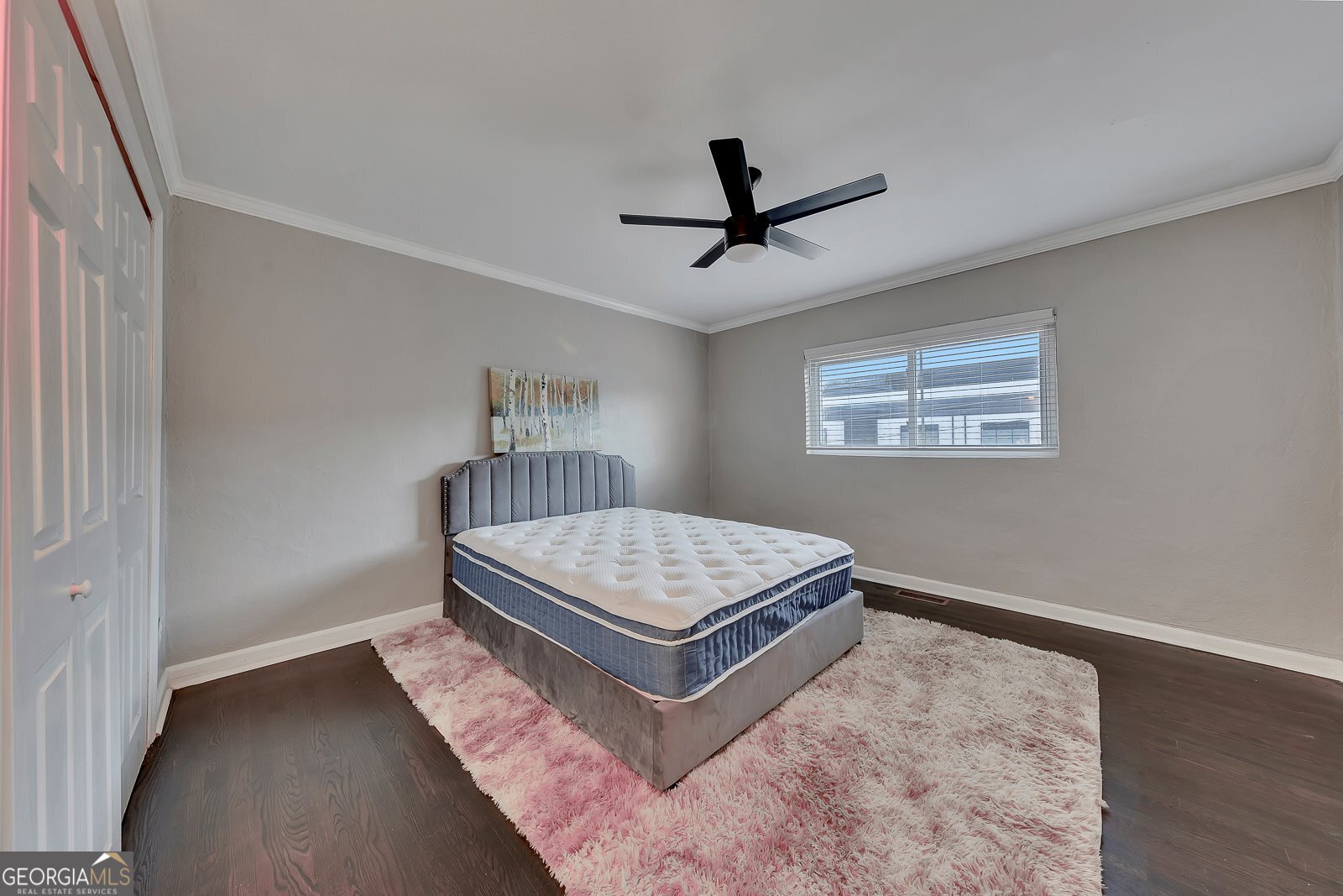1040 Herndon Street Northwest, Unit A Atlanta, GA 30318 - Photo 13 of 28 a living room with a bed furniture and a window