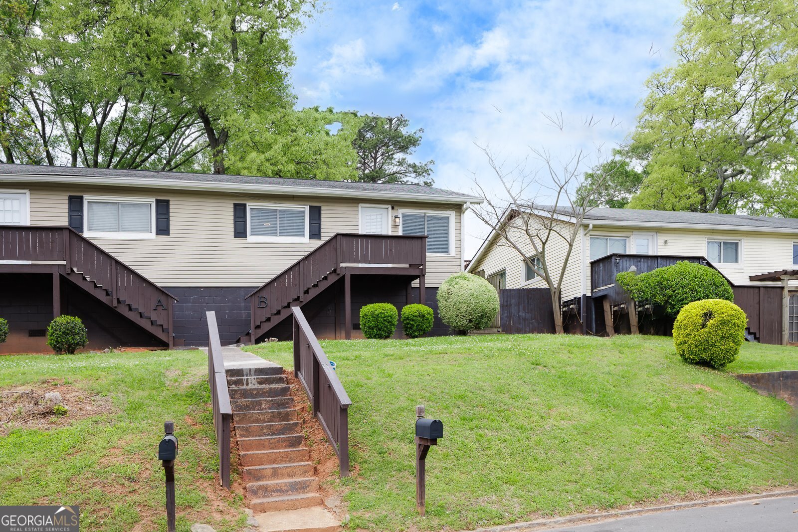 1040 Herndon Street Northwest, Unit A Atlanta, GA 30318 - Photo 2 of 28 a house view with a garden space and potted plants