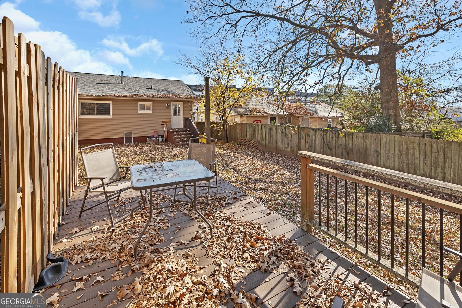 1040 Herndon Street Northwest, Unit A Atlanta, GA 30318 - Photo 24 of 28 a roof deck with table and chairs and potted plants