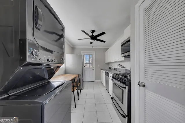 a kitchen with a stove and a microwave