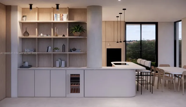 a room with stainless steel appliances a table and chairs in it