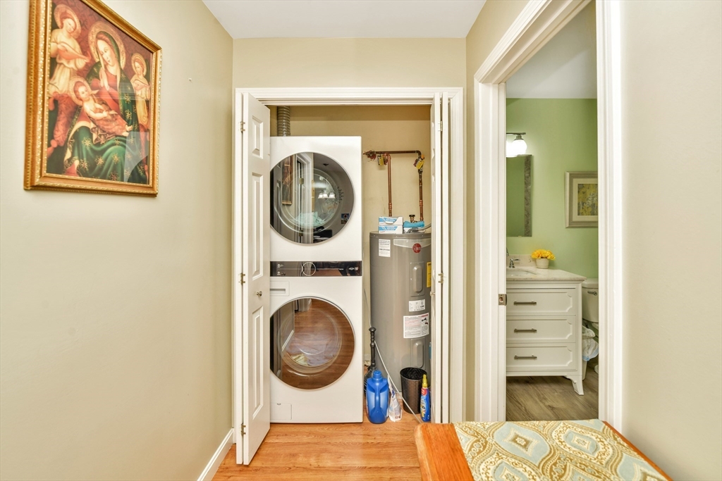 75 Walnut Street, Unit 315 Peabody, MA 01960 - Photo 12 of 14 a view of a bedroom with washer and dryer